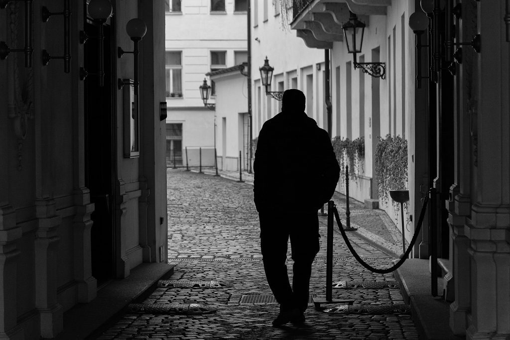 Minimalist street photo of the lonely man silhouette in Prague. 